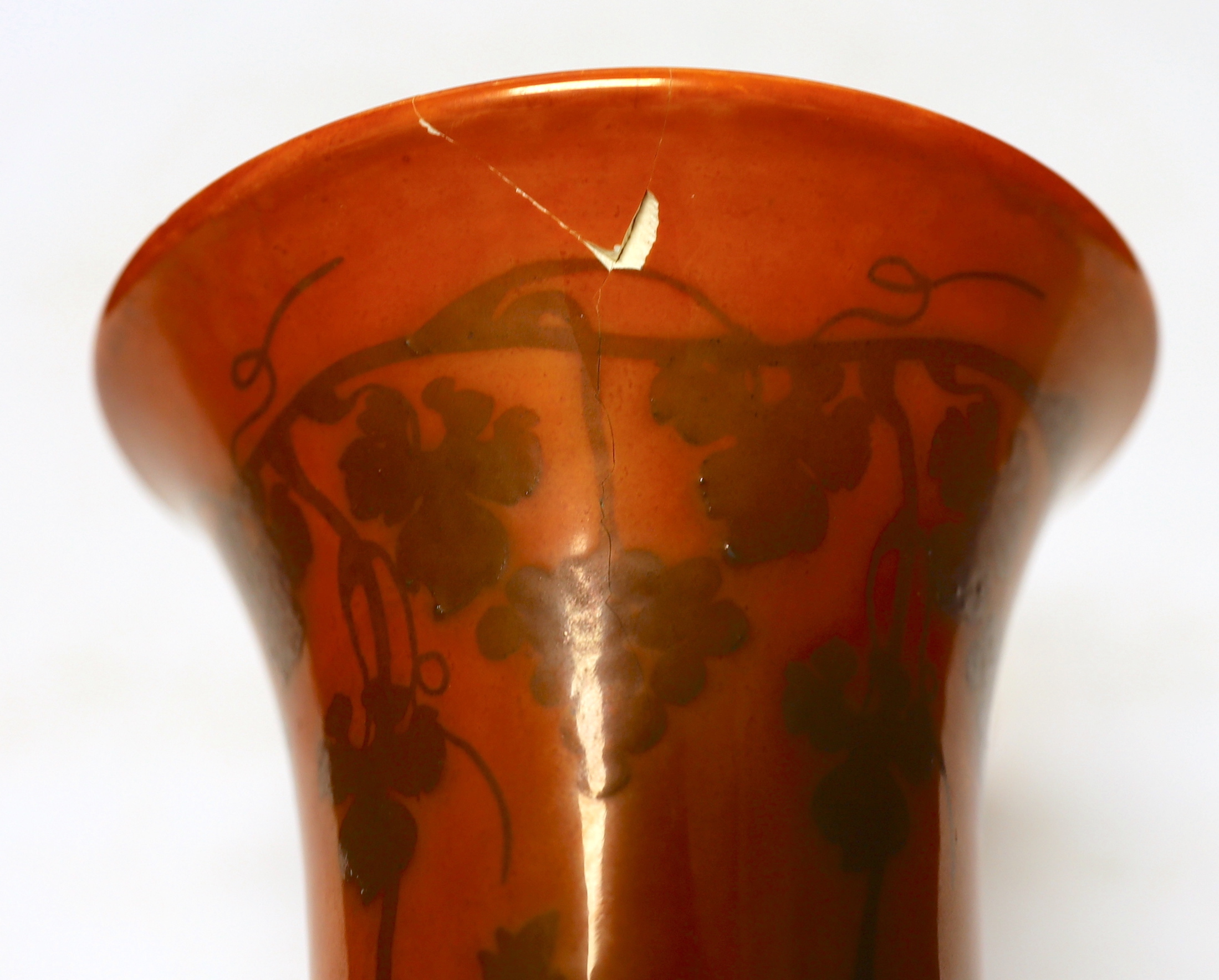 A Ruskin orange glazed vase (a.f) and three similar small bowls by Ruskin and Doulton, vase 23.5cm